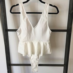 White peplum swimsuit.
